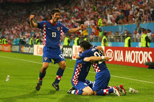Croatian players Nikola Pokrivac (left) and Danijel Pranjic (right) celebrate a goal by Ivan Klasnic (centre) in 2008.