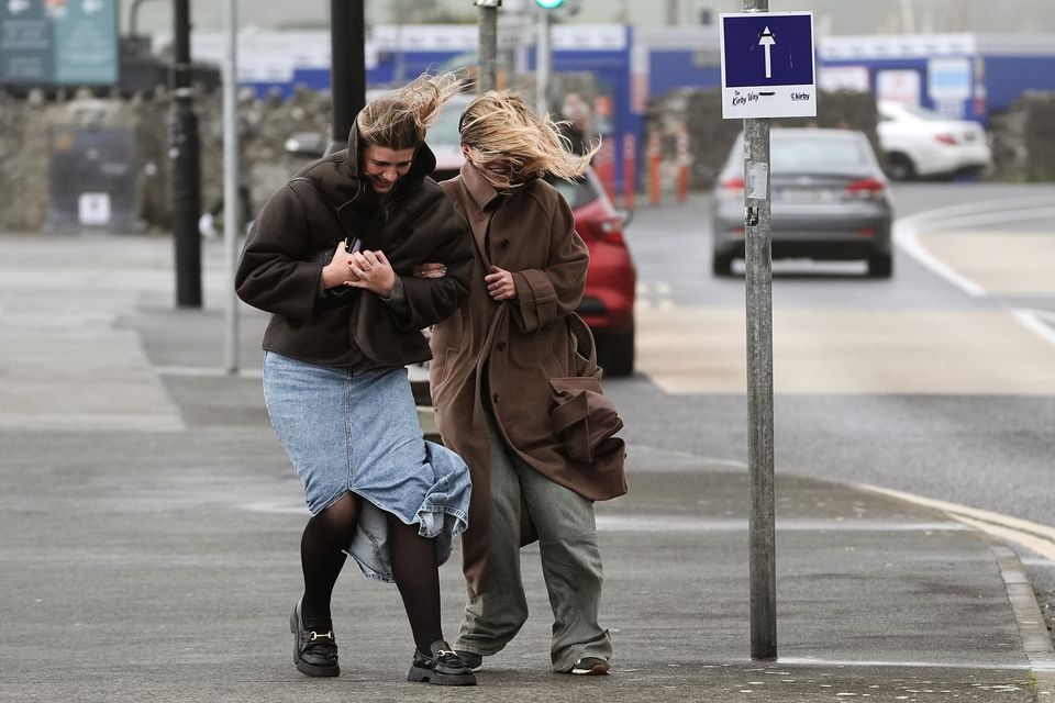 People struggle to walk in the wind in Salthill, Galway. Photo: PA
