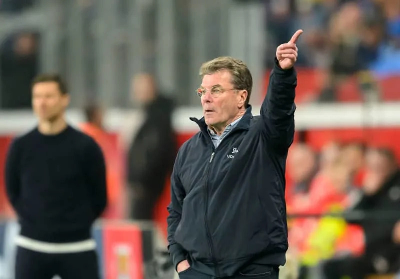 VfL Bochum's coach Dieter Hecking gestures to his players from the touchline during the German Bundesliga soccer match between Bayer 04 Leverkusen and VfL Bochum 1848 at BayArena. Bochum coach Dieter Hecking believes that the use of artificial intelligence (AI) in football can no longer be stopped. Anke Waelischmiller/dpa
