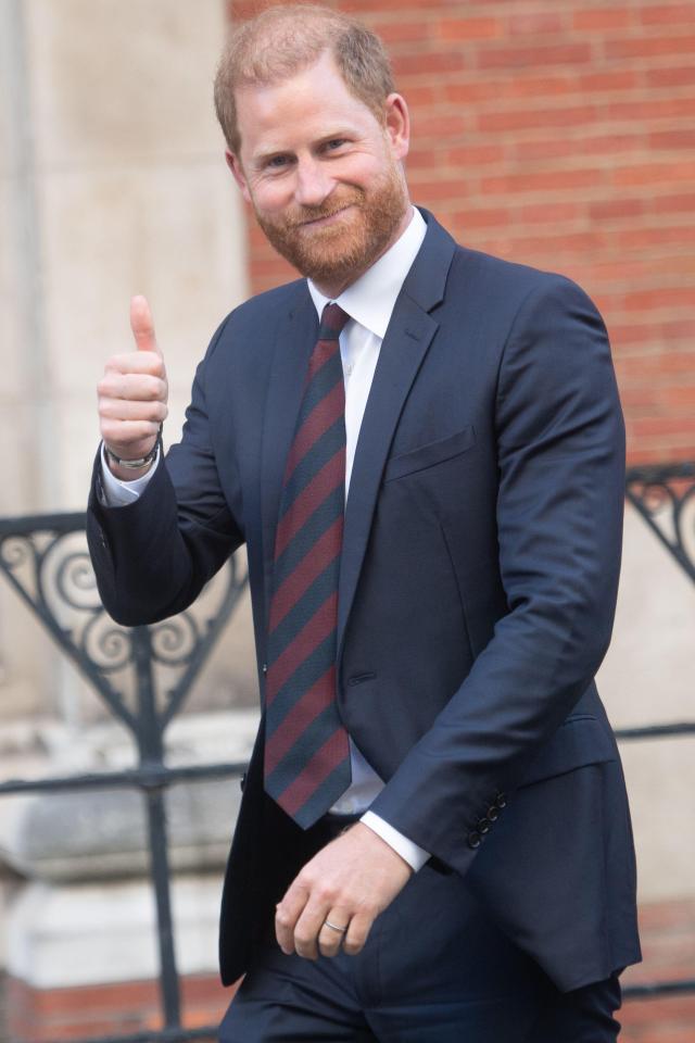 Prince Harry giving a thumbs up after a court hearing.