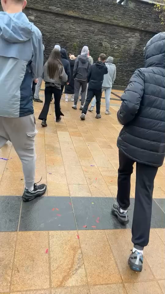 Fighting outside of Backroom Bandits gig in Derry
