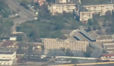 Russians bombing a high rise in Kherson, a major city in Ukraine