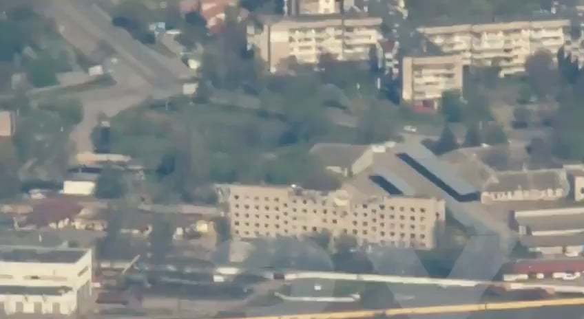 Russians bombing a high rise in Kherson, a major city in Ukraine