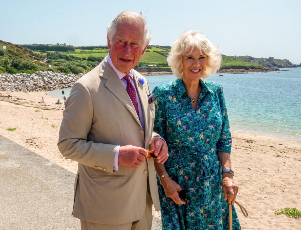The Duke and Duchess of Cornwall on a beach.