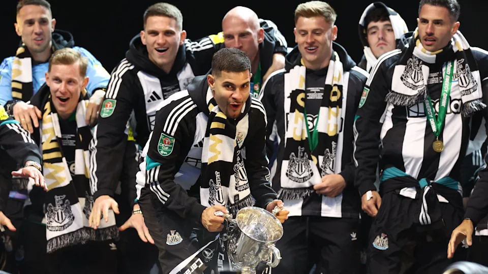 Newcastle players celebrate with the EFL Cup