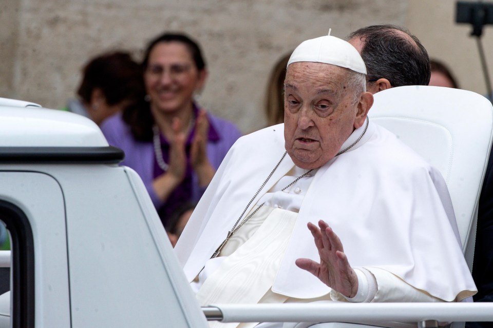 Pope Francis waving to the faithful.