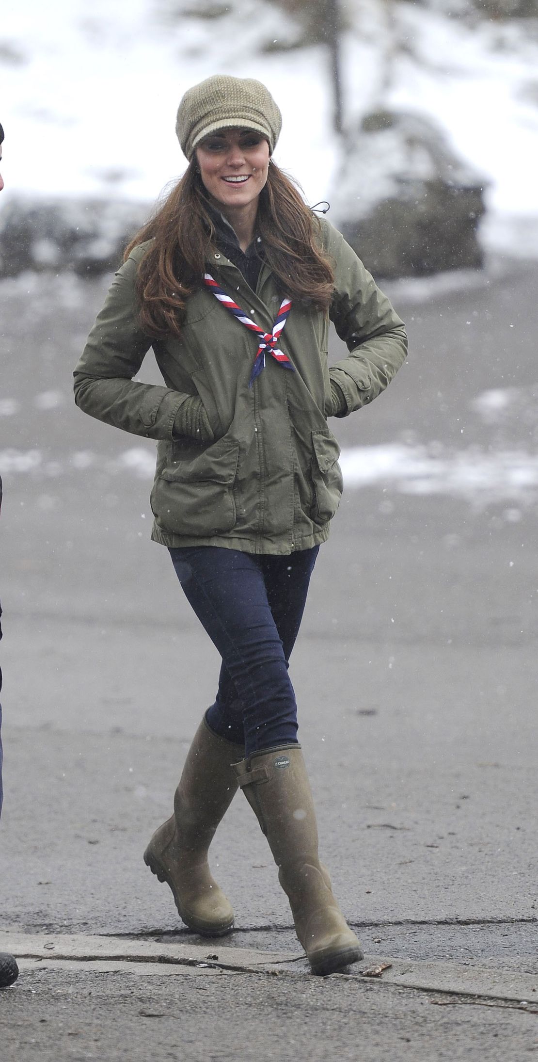 On a 2013 visit to Windermere, Cumbria, the Princess of Wales styled her hat with a green jacket and skinny trousers tucked into boots.