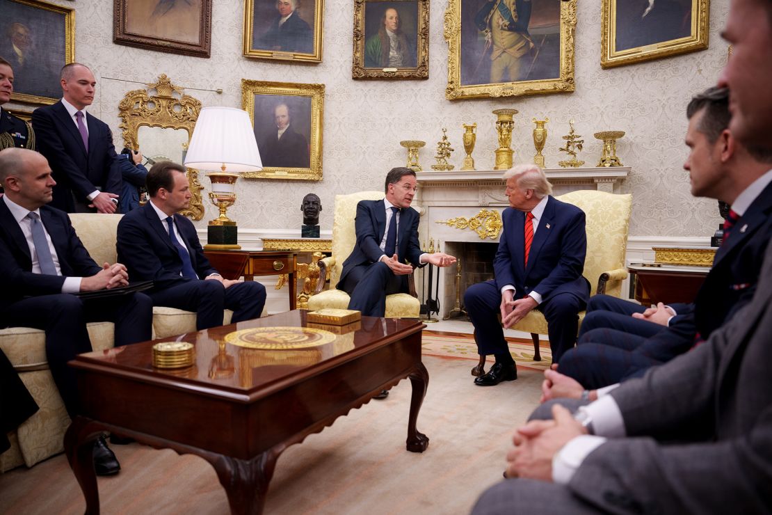 NATO Secretary General Mark Rutte, center, speaks to President Donald Trump in a White House meeting on March 13.