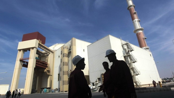 A group of workers outside the reactor building at the Russian-built Bushehr nuclear power plant in southern Iran