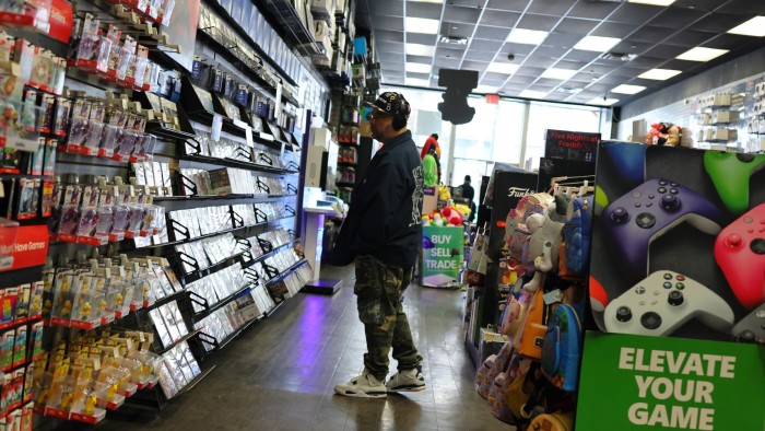 Person inside a GameStop store.