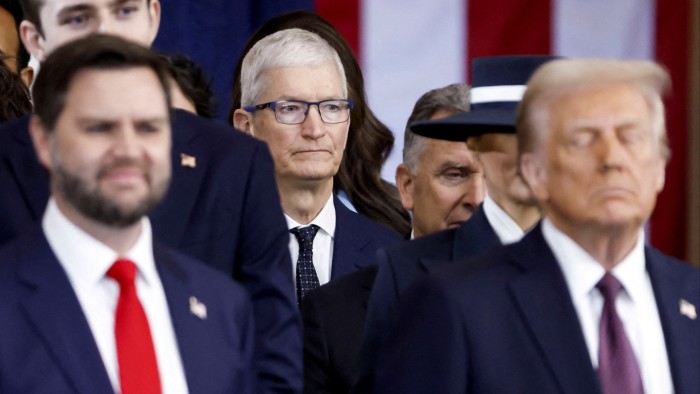 Apple chief executive Tim Cook seated behind US President Donald Trump and vice-president JD Vance at the inauguration in Washington in January