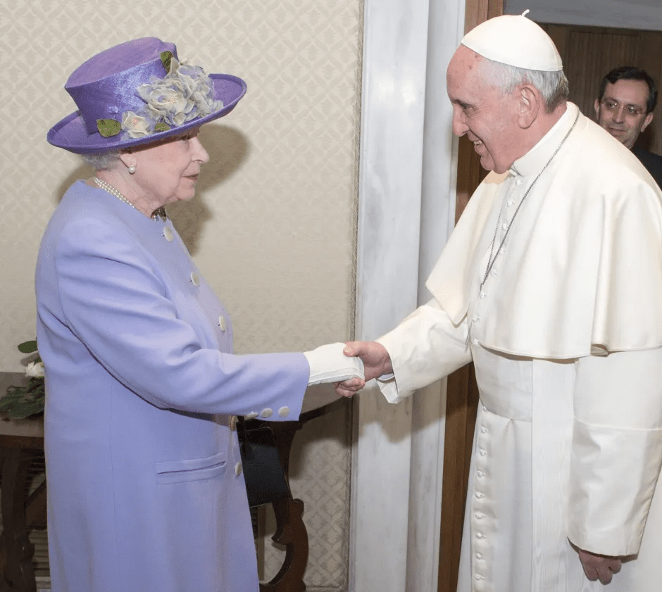 Queen Elizabeth II shaking hands with Pope Francis.
