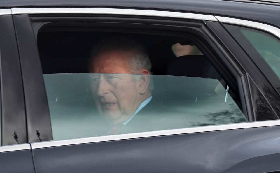 King Charles III in a car.