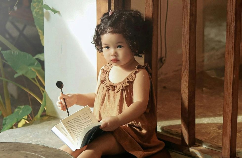 little girl with a book