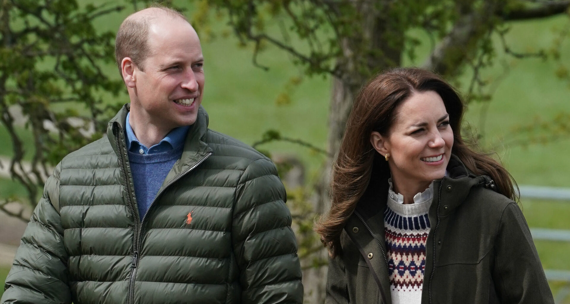 Prince William and Kate Middleton wear matching dark green coats for a walk