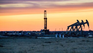 Photo of oil rigs at sunset