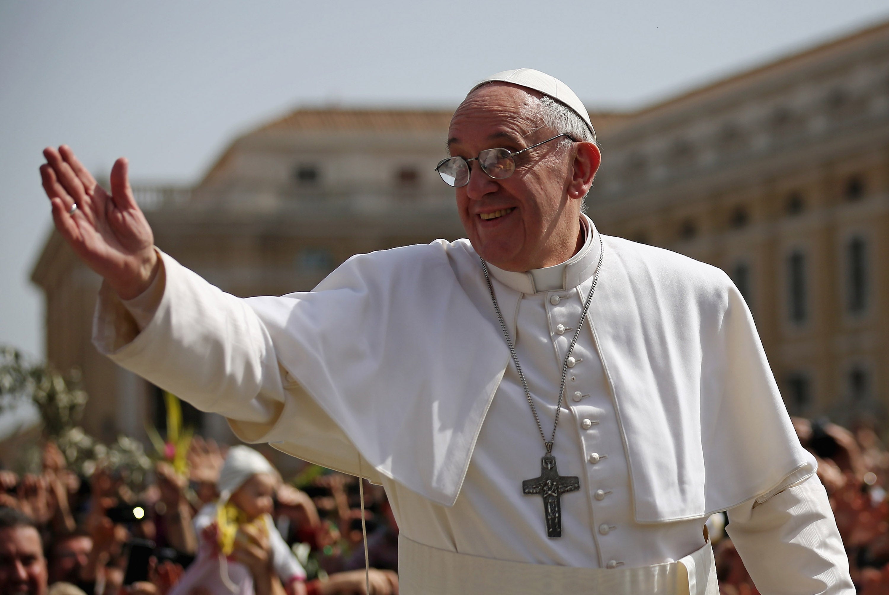 Pope Francis delivering his blessing to the faithful gathered in St. Peter's Square during Palm Sunday Mass on March 24, 2013 in the Vatican