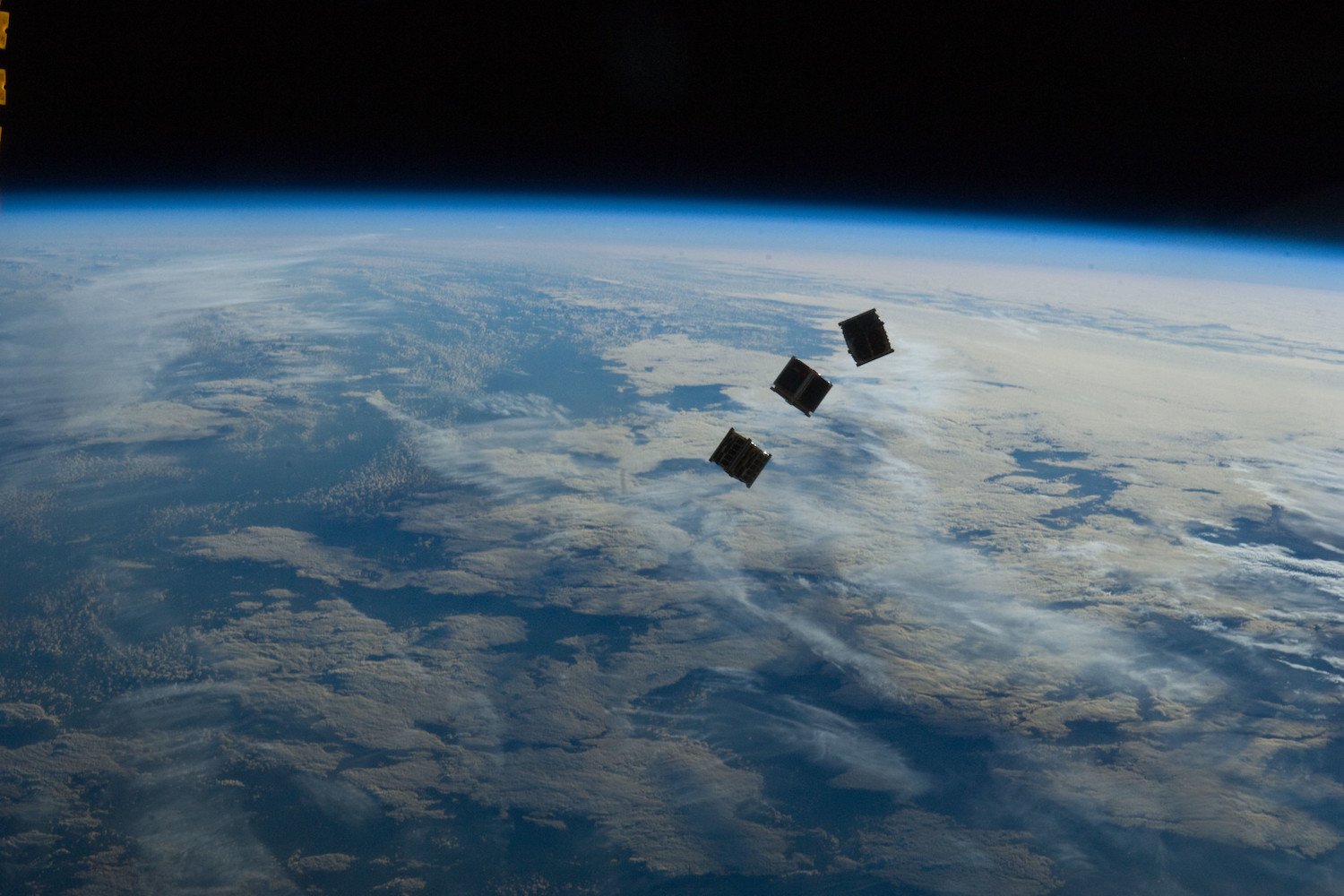 A trio of small satellites photographed outside the ISS in 2012 (not related to the Russian satellite).