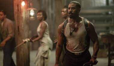 This image released by Warner Bros Pictures shows Michael B. Jordan, right, in a scene from "Sinners." (Warner Bros. Pictures via AP)
