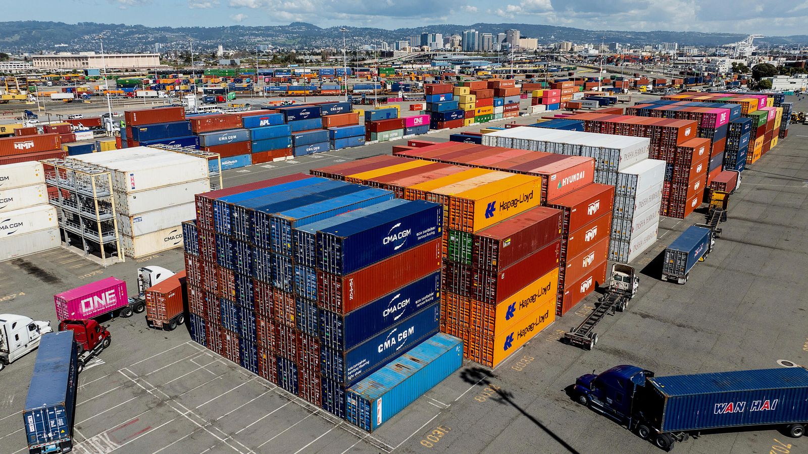 Cargo containers line a shipping terminal at the Port of Oakland on Thursday, April 3, 2025, in Oakland, Calif. (AP Photo/Noah Berger)