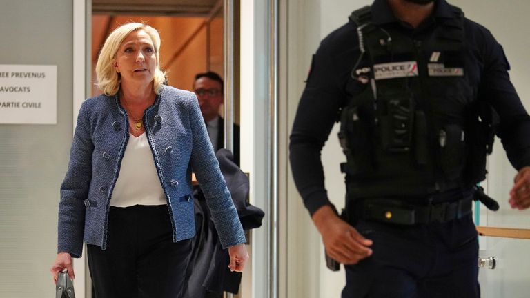 Marine Le Pen leaves the courtroom in Paris. Pic: AP