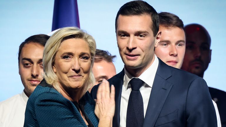 FILE - Leader of the French far-right National Rally Marine Le Pen, left, and lead candidate of the party for the upcoming European election Jordan Bardella during a political meeting on June 2, 2024 in Paris. Jordan Bardella, Le Pen's 28-year-old prot..g.. who she'd been hoping to install as prime minister, grumbled that "the alliance of dishonor" between the National Rally's rivals kept it from power. (AP Photo/Thomas Padilla, File)