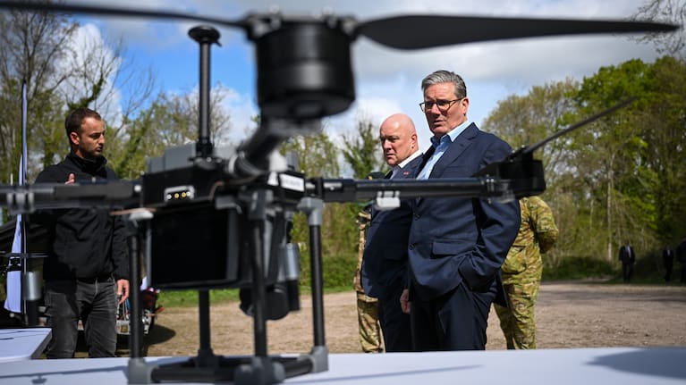 UK Prime Minister, Sir Keir Starmer, and Prime Minister of New Zealand, Christopher Luxon, look at drones on a display by SYOS, during a visit to a military base training Ukrainian troops, on April 22, 2025 in West of England.