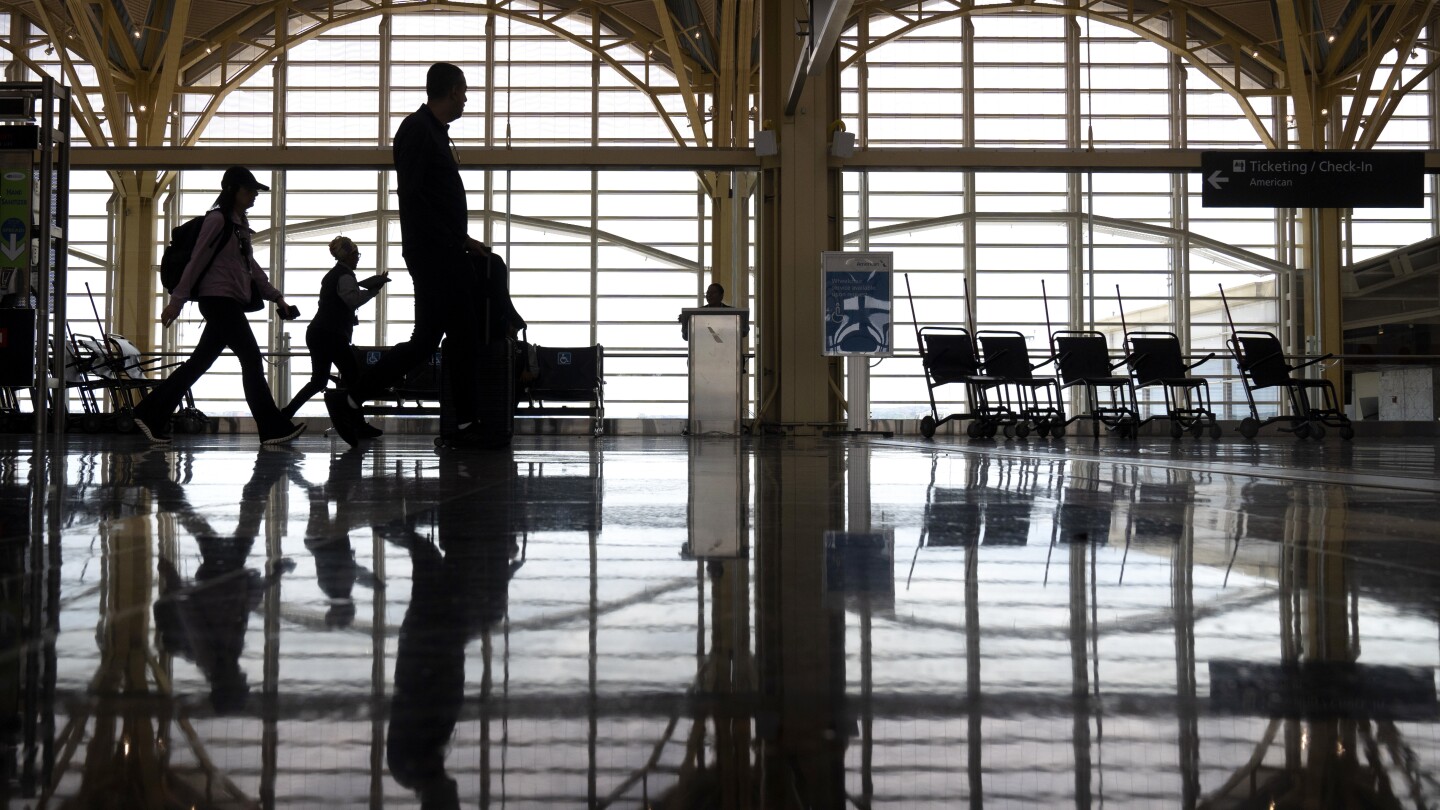 The wing tip of an American Airlines plane strikes another aircraft at a DC airport