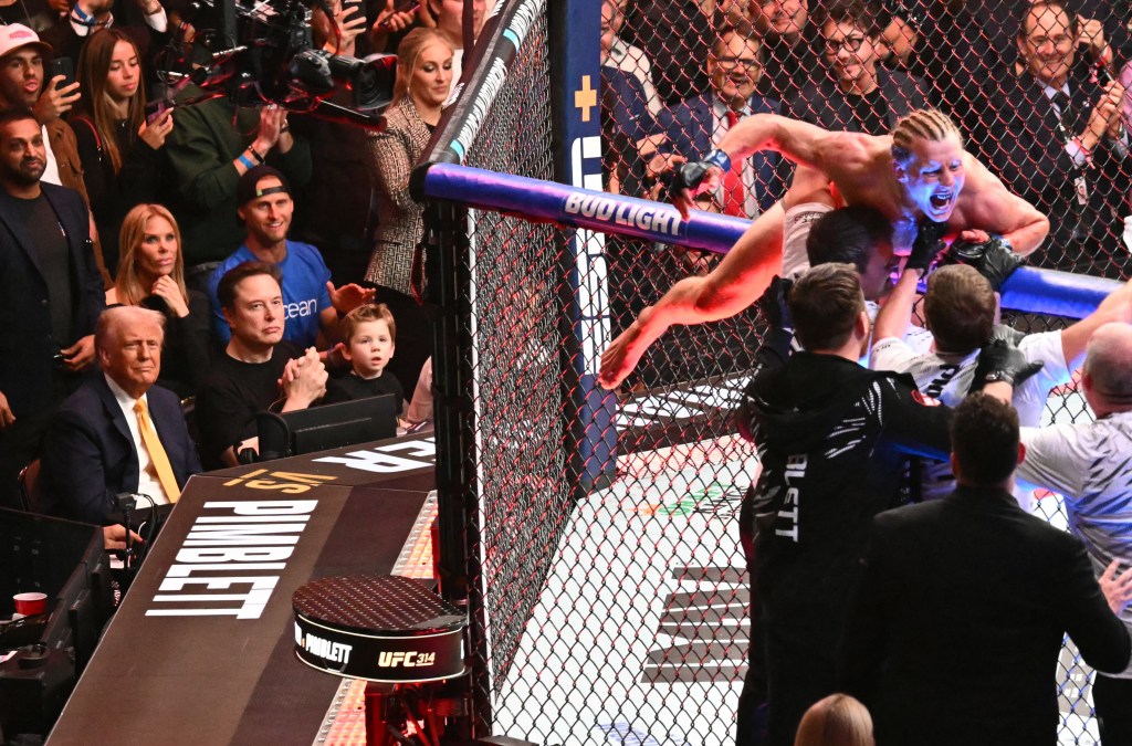 US President Donald Trump and Elon Musk with his son X Æ A-12 watching English fighter Paddy Pimblett celebrating his victory at UFC 314 in Miami, Florida.