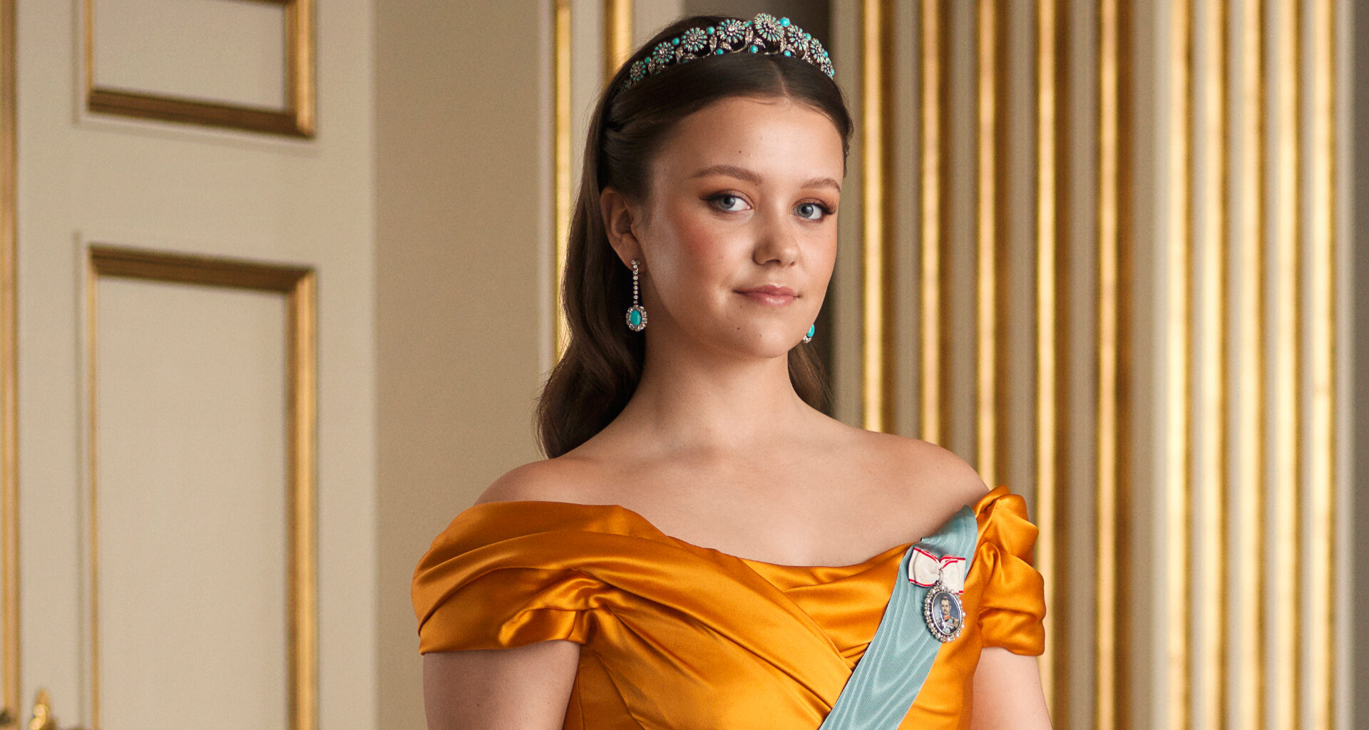 Princess Isabella wearing a gold gown and tiara on her 18th birthday