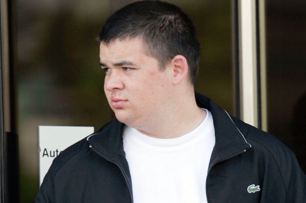 Photo of a young man in a black jacket.