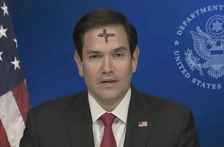 Marco Rubio with ash cross on his forehead during an interview.