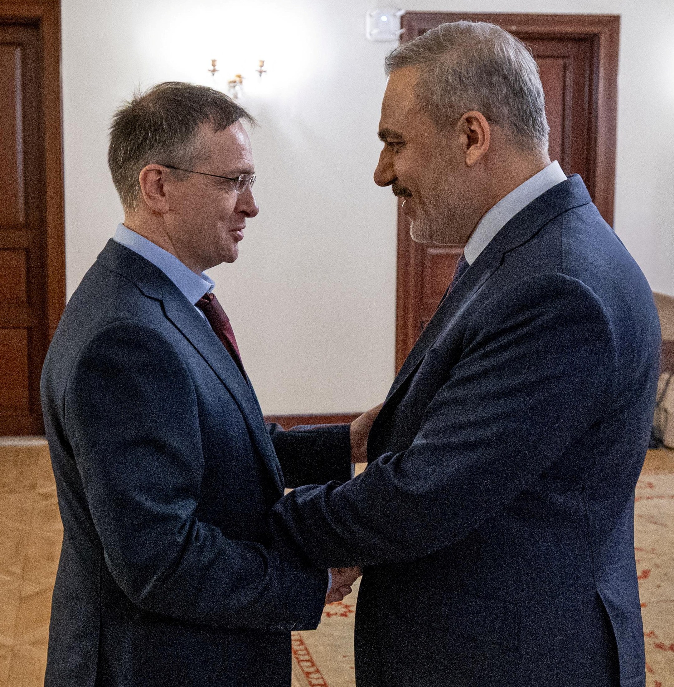 Hakan Fidan, the Turkish foreign minister, with the head of Russian delegation Vladimir Medinsky on Friday