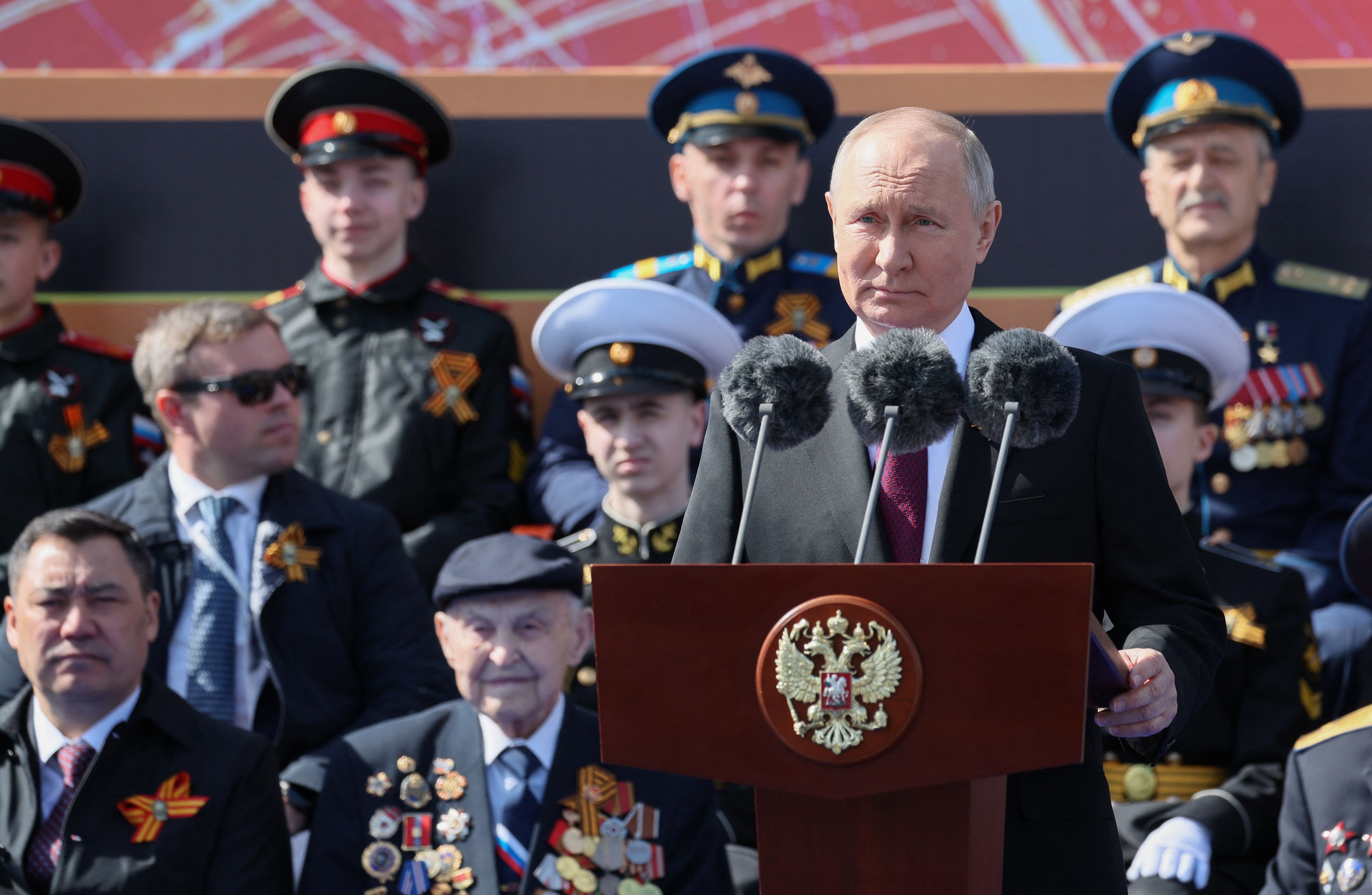 Vladimir Putin speaking at a military parade in Moscow.