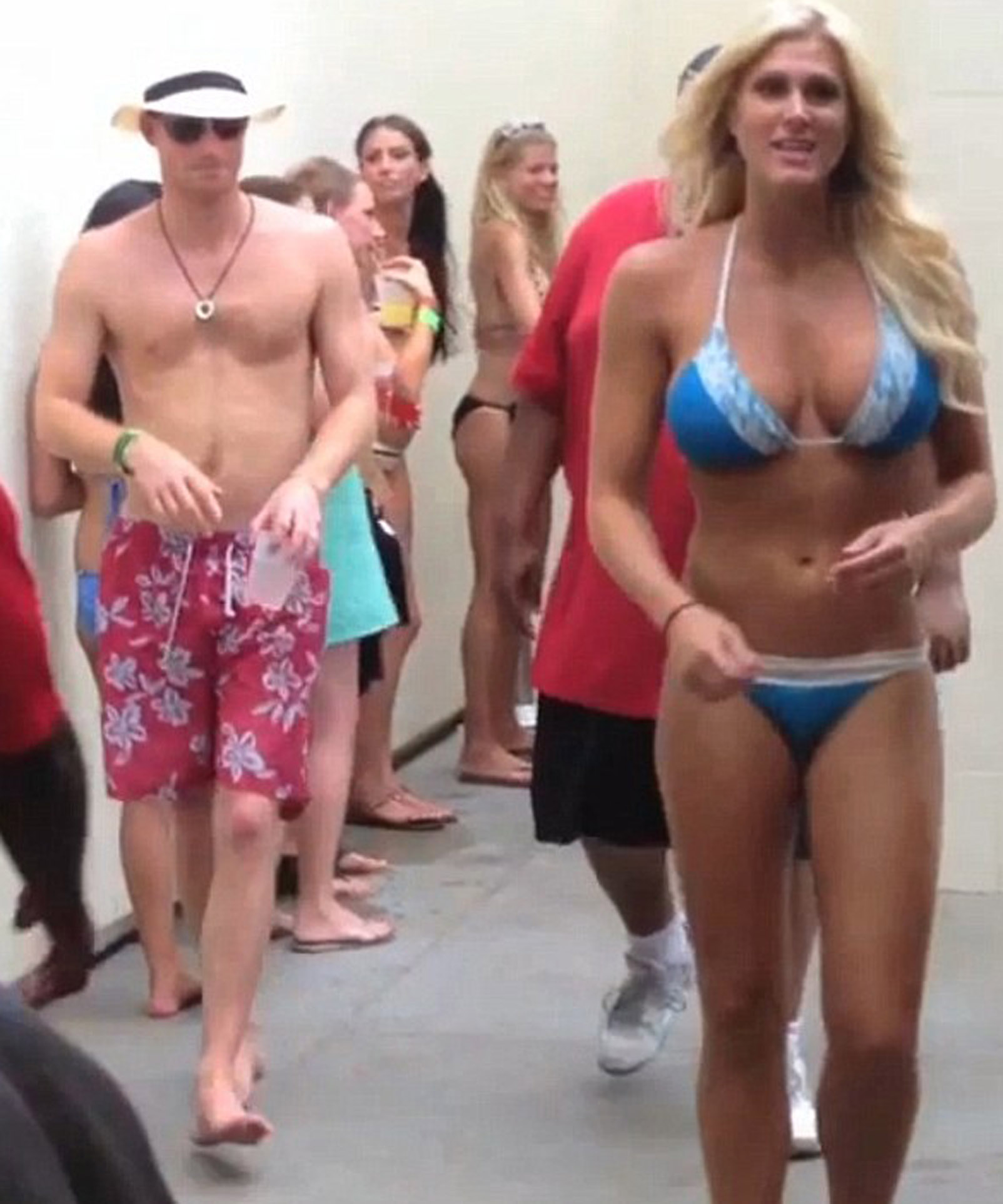 Prince Harry surrounded by women in bikinis.