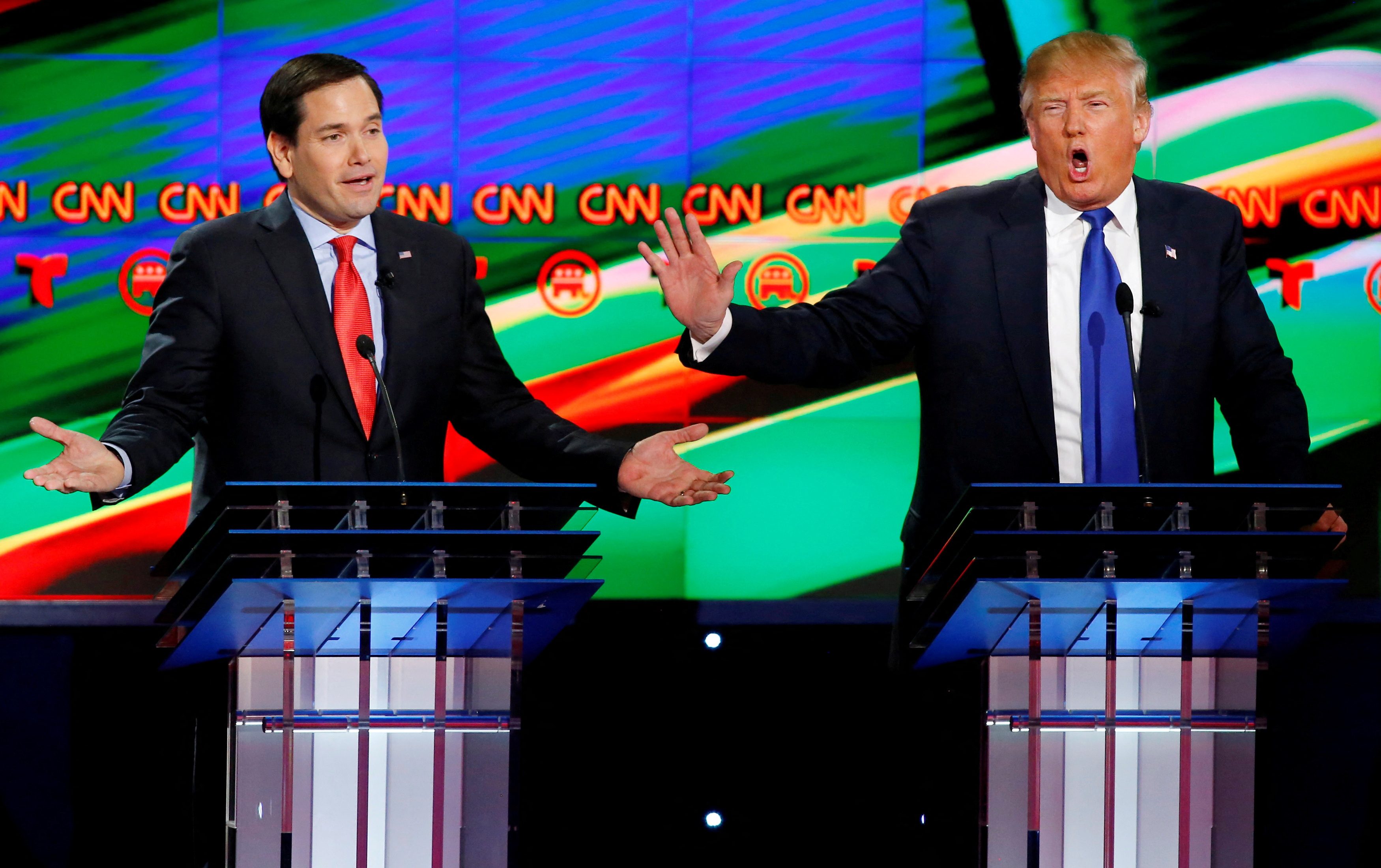 Marco Rubio and Donald Trump speaking simultaneously at a 2016 Republican presidential debate.