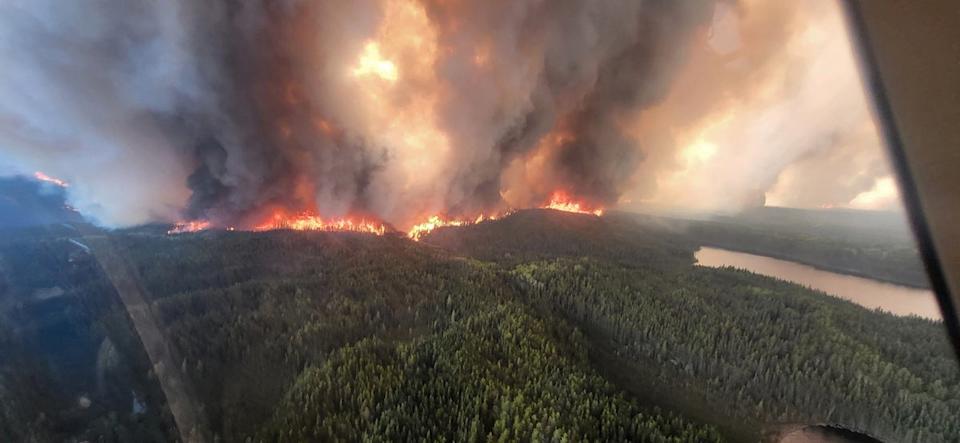 Smoke rises from a wildfire in Flin Flon, Manitoba, Canada (REUTERS)
