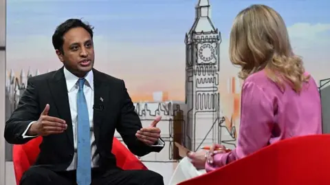 BBC Reform UK chairman Zia Yusuf talks to Laura Kuenssberg on set of her show