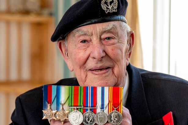 War veteran Henry Rice with his medals from World War II