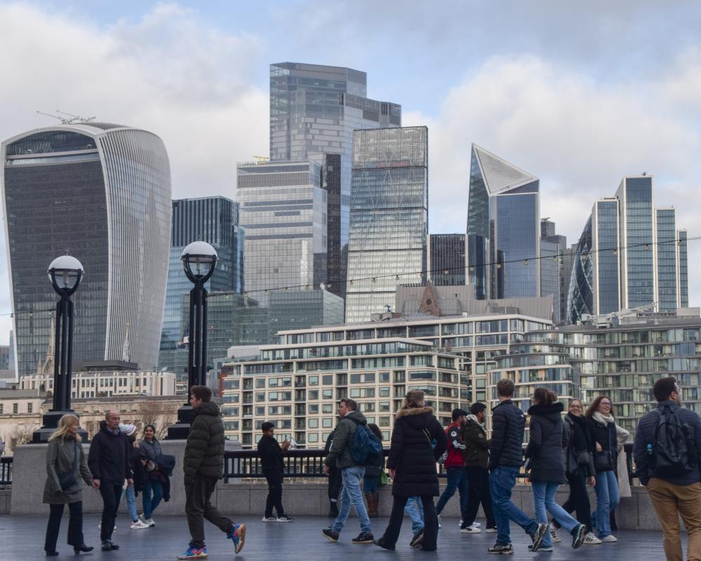 Commuters and London skyline