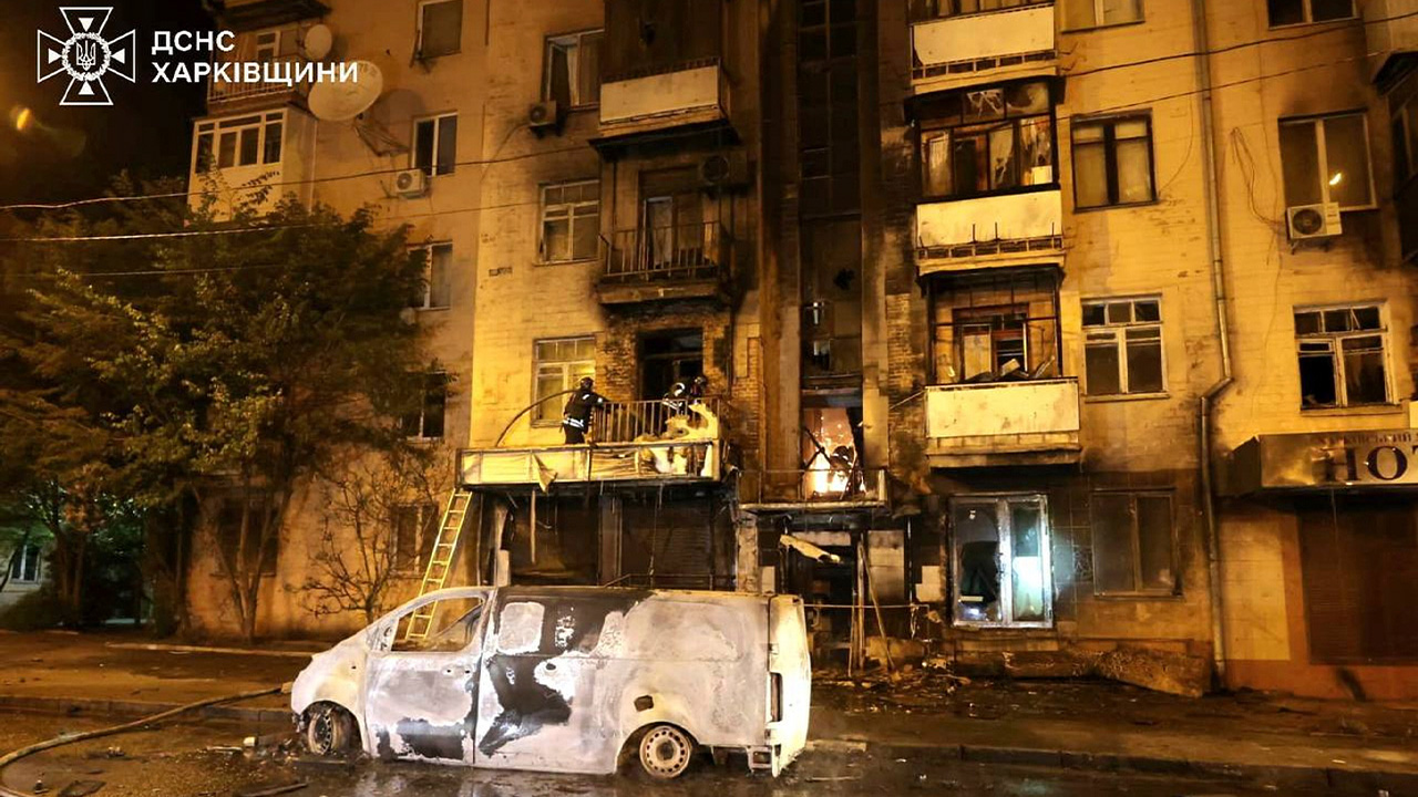 In this photo provided by the Ukrainian Emergency Service, emergency services personnel work to extinguish a fire following a Russian attack in Kharkiv, Ukraine, May 3, 2025.
