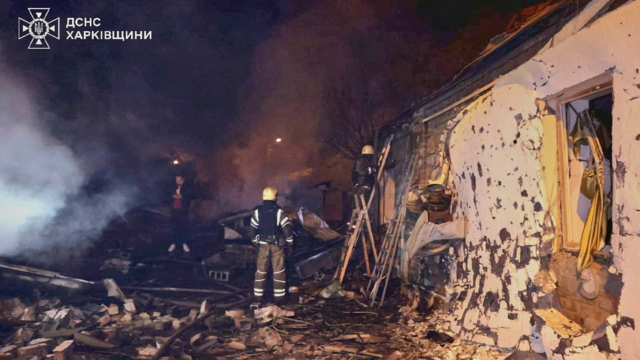In this photo provided by the Ukrainian Emergency Service, emergency services personnel work to extinguish a fire following a Russian attack in Kharkiv, Ukraine, May 3, 2025.