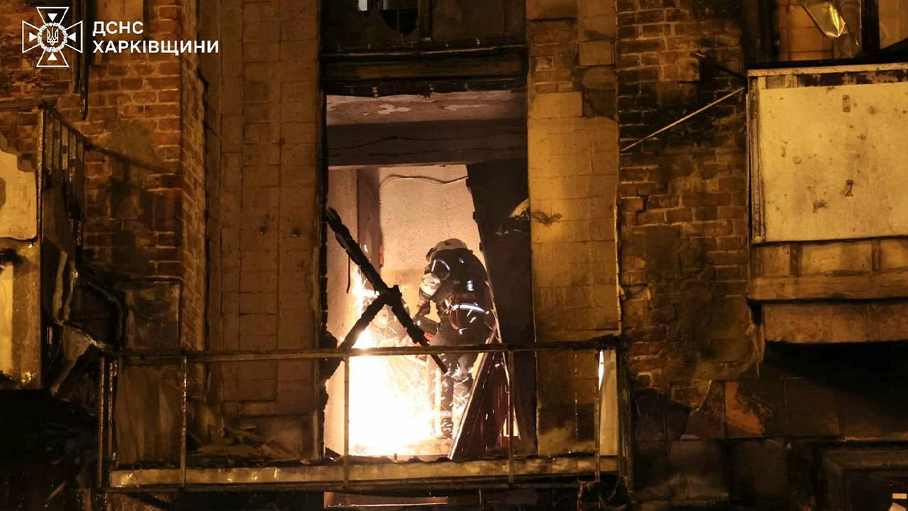 In this photo provided by the Ukrainian Emergency Service, emergency services personnel work to extinguish a fire following a Russian attack in Kharkiv, Ukraine, May 3, 2025.