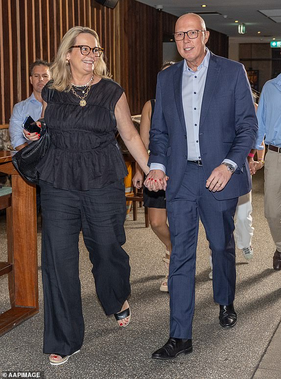 Leader of the Opposition Peter Dutton and wife Kirilly arrive for a â¿¿Pub Test' segment broadcast on Sky News on Day 3 of the 2025 federal election campaign, at the Eatons Hill Hotel, in Brisbane, Monday, March 31, 2025. (AAP Image/Pool, THOMAS LISSON) NO ARCHIVING