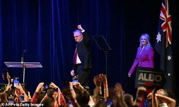 Australia's Prime Minister Anthony Albanese arrives onstage with his partner Jodie Haydon  after winning the general election at the Labor Party election night event in Sydney on May 3, 2025. Left-leaning Prime Minister Anthony Albanese triumphed on May 3 in Australia's general election, according to media projections, prevailing in a vote shaped by inflation woes and Trump tariffs. (Photo by Saeed KHAN / AFP) (Photo by SAEED KHAN/AFP via Getty Images)