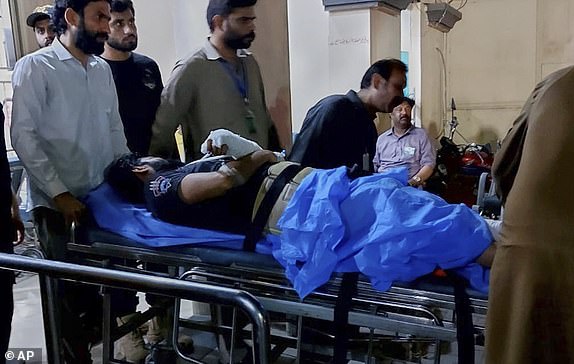 Workers transport a man injured by a suspected Indian missile attack, at a hospital in Bahawalpur, Pakistan, Wednesday, May 7, 2025. (AP Photo/Asim Tanveer)