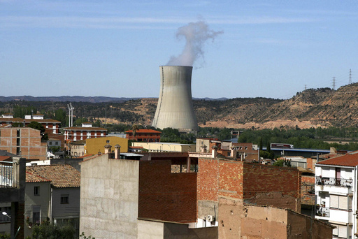 FILE - The Asco I nuclear power station, center, is seen near houses in the small town of Asco, Spain in Tuesday, April 15, 2008. (AP Photo/David Ramos, File)