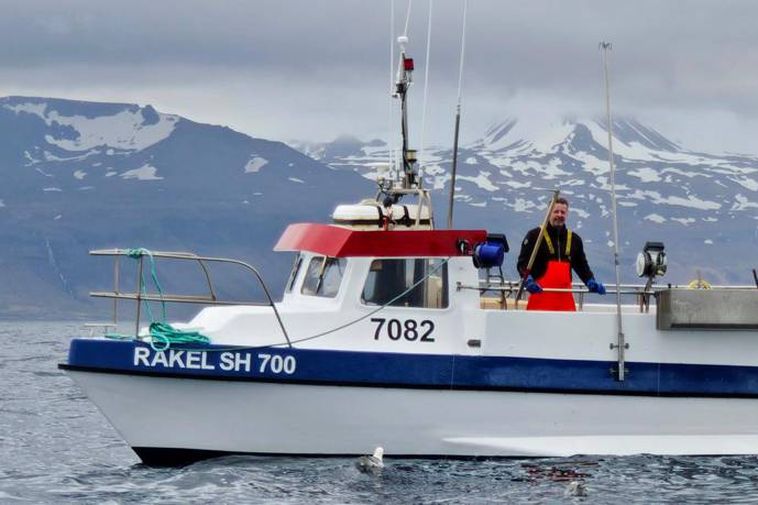 Couple fishing in harmony off the coast of Ólafsvík