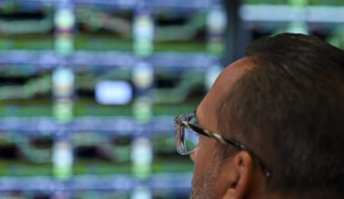 A trader watches a screen