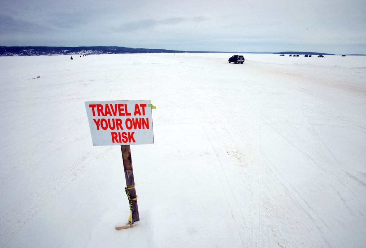 A car travels the ice road on Lake Superior between Bayfield, Wisconsin and Madeline Island February 15, 2014. According to the National Oceanic and Atmospheric Administration (NOAA) Great Lakes Environmental Research Laboratory, about 94% of Lake Superior is covered with ice. The Great Lakes, which contain one fifth of the world's surface fresh water, are 88% covered with ice. Picture taken February 15, 2014. 